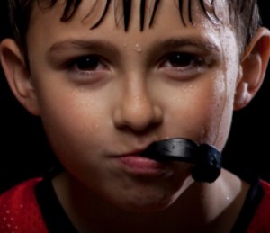 Boy using mouthguard for sport